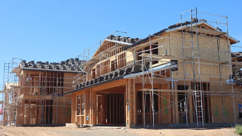 Houses under construction with scaffolding