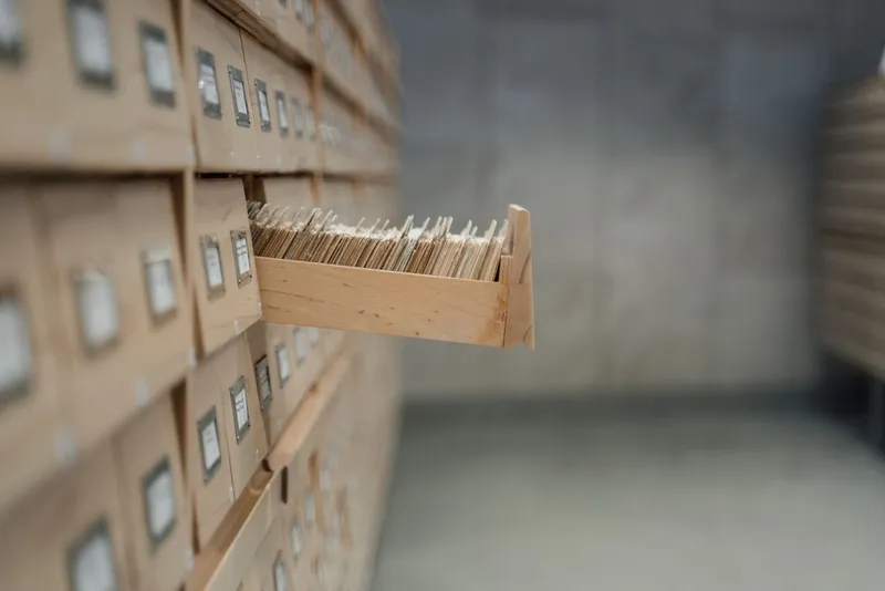 An open card-catalogue drawer in an archive